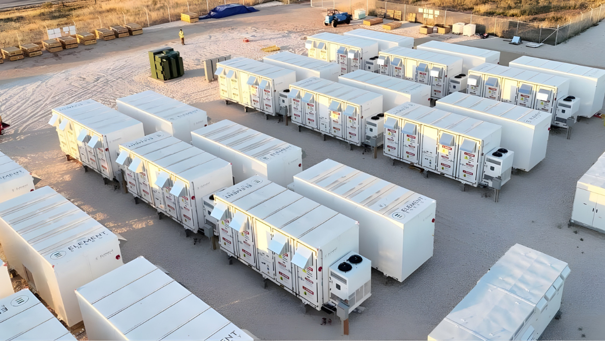 Rows of modular second-life EV battery storage units staged at a U.S. energy facility.
