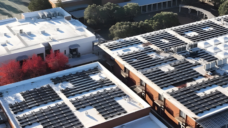 Aerial view of solar panel arrays mounted on building rooftops